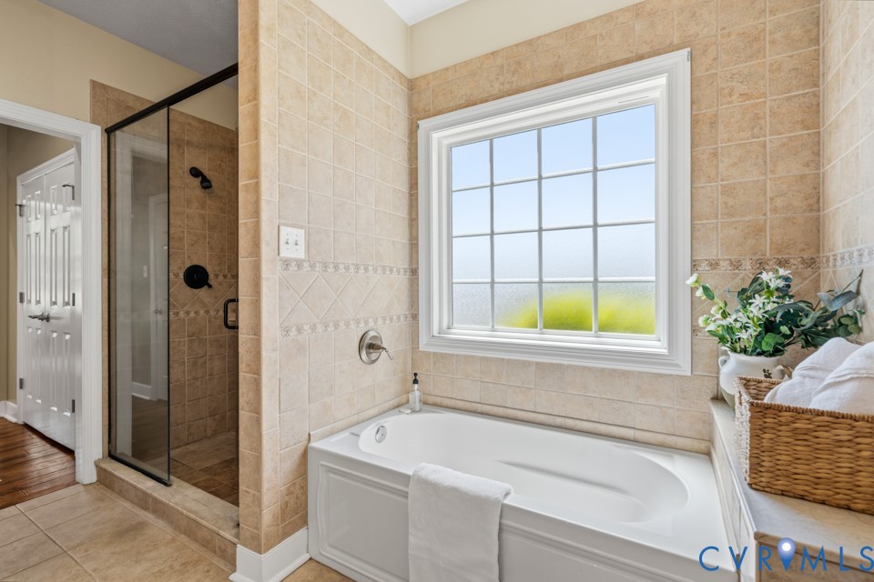 7191 Figuly Road Mechanicsville, VA 23111 - Photo 21 of 46 a bathroom with a bathtub and shower