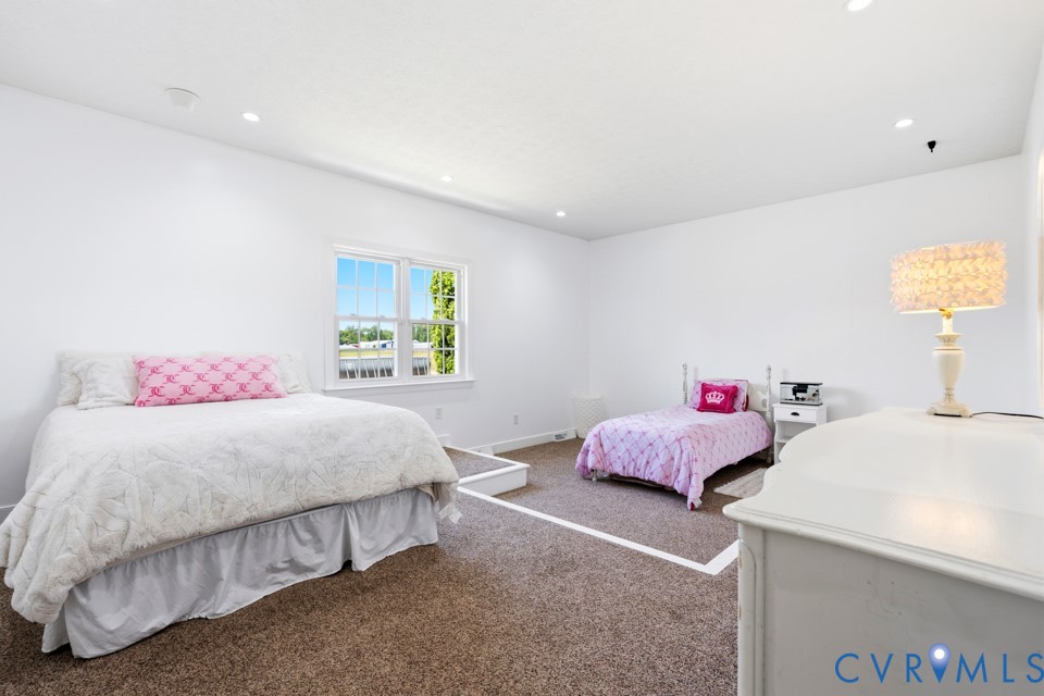 7191 Figuly Road Mechanicsville, VA 23111 - Photo 28 of 46 a bedroom with a bed and window