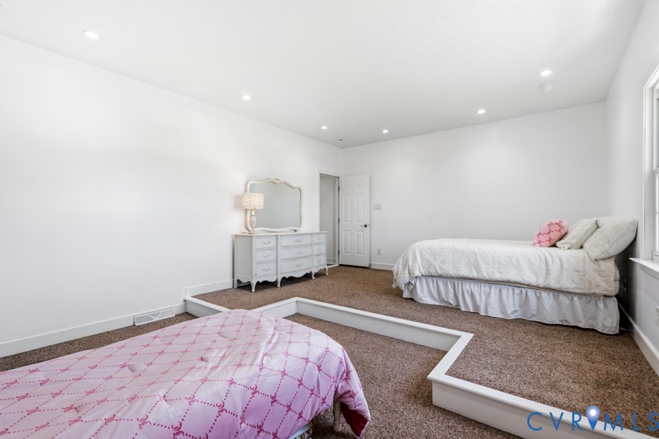 7191 Figuly Road Mechanicsville, VA 23111 - Photo 29 of 46 a bedroom with a bed and a window