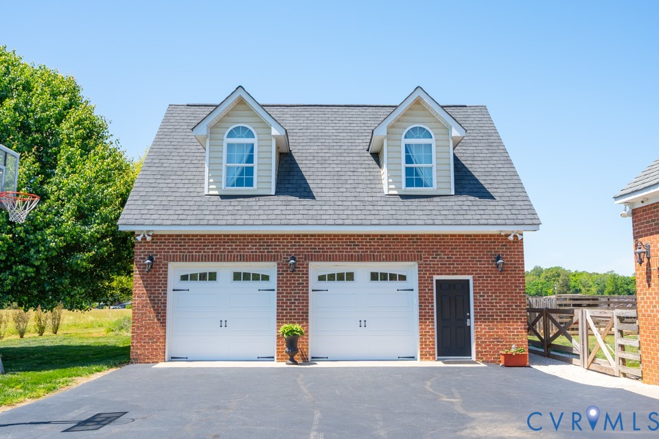 7191 Figuly Road Mechanicsville, VA 23111 - Photo 33 of 46 a view of a brick house with a yard and large tree