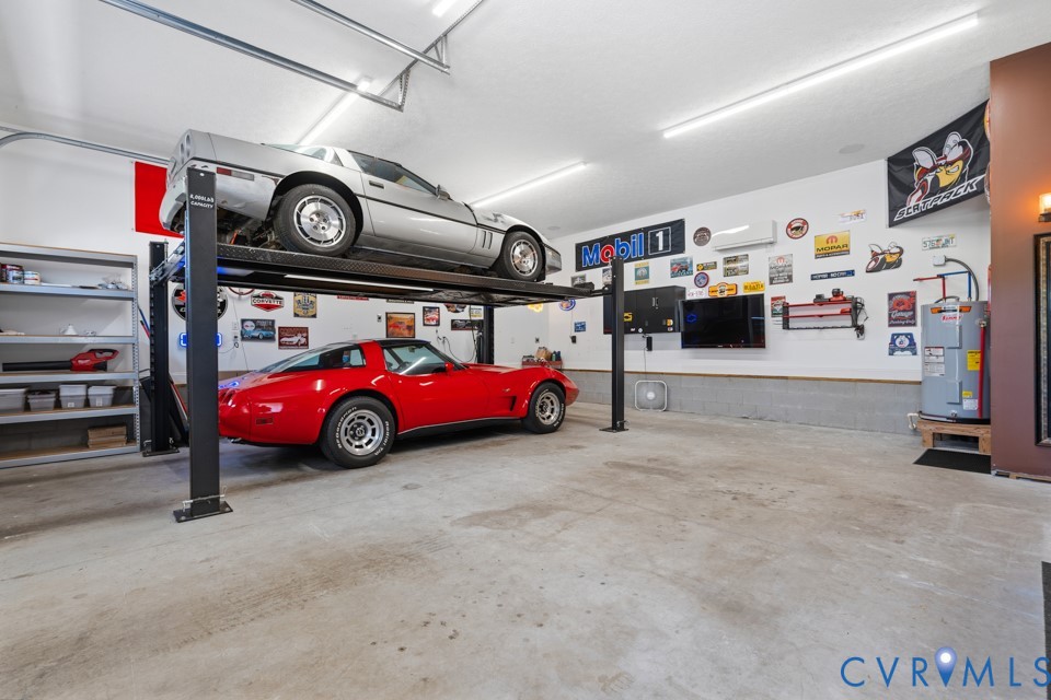 7191 Figuly Road Mechanicsville, VA 23111 - Photo 34 of 46 a view of parking garage with cars and other equipment