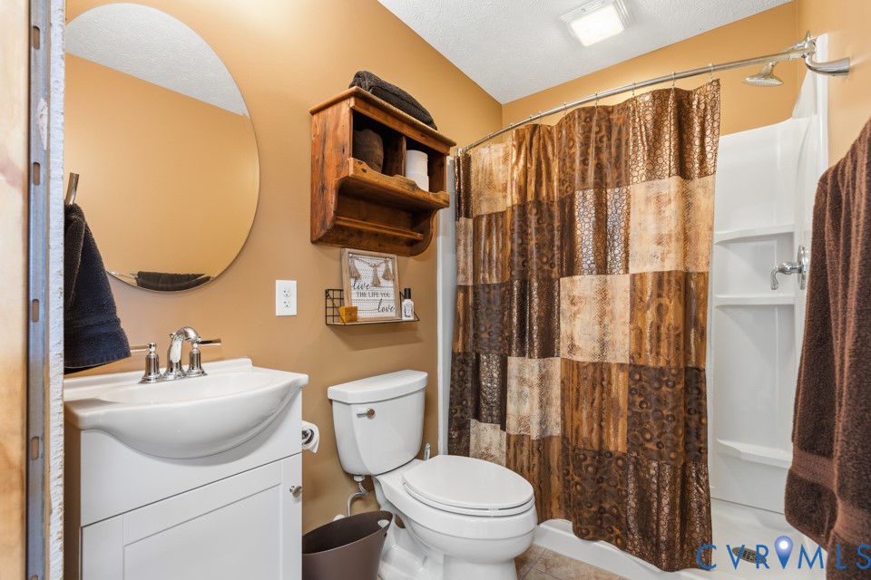 7191 Figuly Road Mechanicsville, VA 23111 - Photo 40 of 46 a bathroom with a sink a toilet and shower