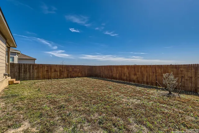 a view of an house next to a yard