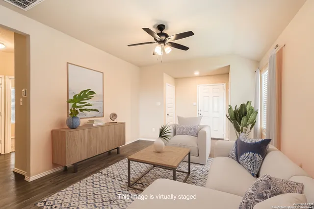 a living room with furniture and a window