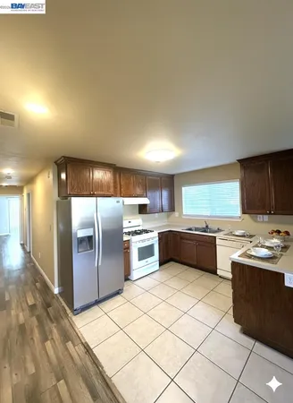 a kitchen with stainless steel appliances lots of counter top space and cabinets