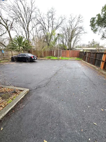 a view of street with parked cars
