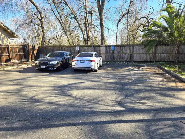 a view of street with parked cars