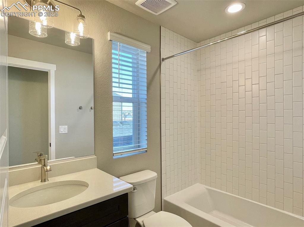 3527 Summer Dream Avenue Colorado Springs, CO 80922 - Photo 12 of 26 a bathroom with a sink a toilet and shower