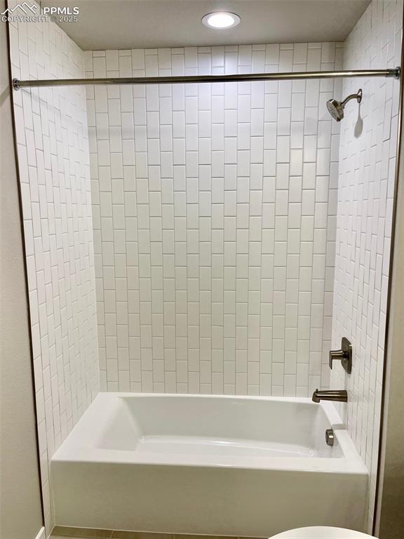 3527 Summer Dream Avenue Colorado Springs, CO 80922 - Photo 14 of 26 a bathroom with a bathtub and shower