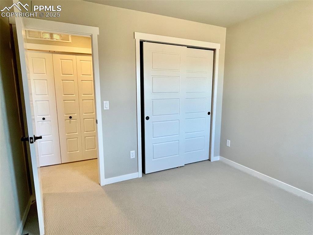 3527 Summer Dream Avenue Colorado Springs, CO 80922 - Photo 15 of 26 an empty room with windows