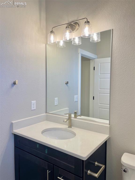 3527 Summer Dream Avenue Colorado Springs, CO 80922 - Photo 20 of 26 a bathroom with a sink and a mirror