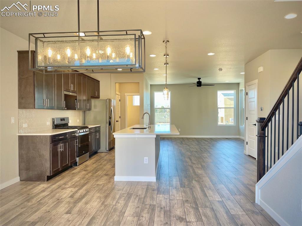 3527 Summer Dream Avenue Colorado Springs, CO 80922 - Photo 2 of 26 a open kitchen with stainless steel appliances granite countertop a stove and cabinets