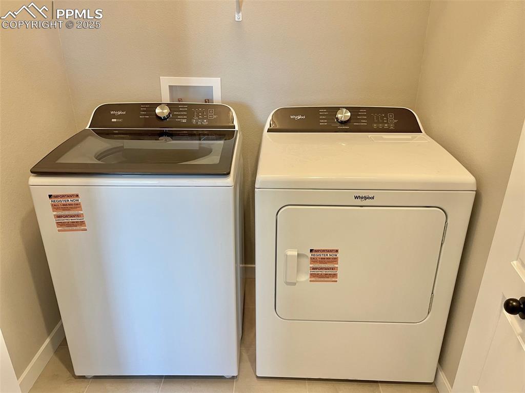 3527 Summer Dream Avenue Colorado Springs, CO 80922 - Photo 24 of 26 a utility room with dryer and washer