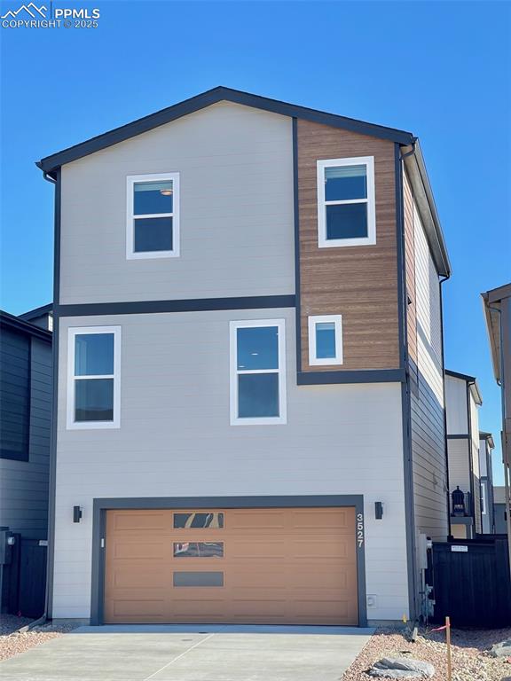 3527 Summer Dream Avenue Colorado Springs, CO 80922 - Photo 25 of 26 a front view of a house with parking