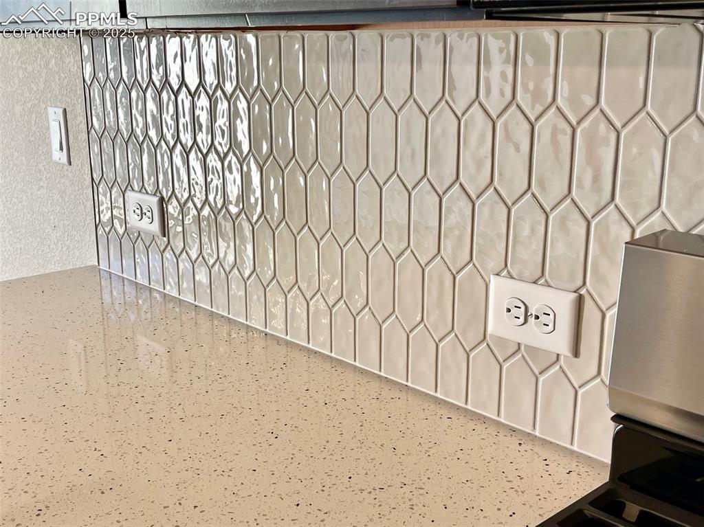 3527 Summer Dream Avenue Colorado Springs, CO 80922 - Photo 7 of 26 a view of a refrigerator with white walls