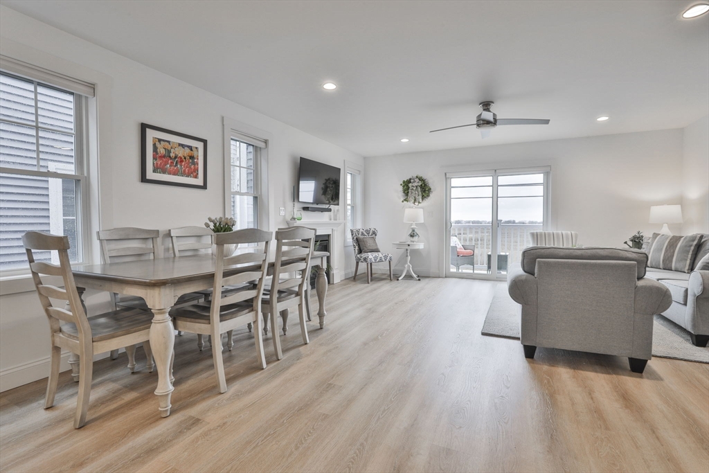 207 Beach Road, Unit C2 Salisbury, MA 01952 - Photo 11 of 35 a view of a dining room with furniture window and wooden floor
