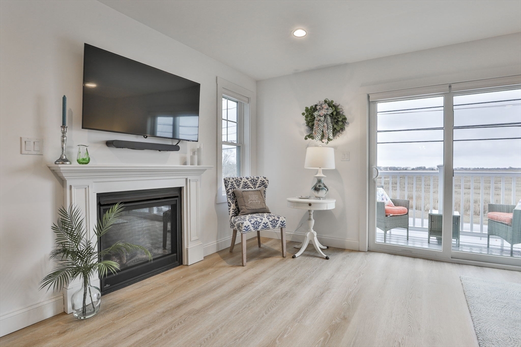 207 Beach Road, Unit C2 Salisbury, MA 01952 - Photo 14 of 35 a living room with furniture and a fireplace