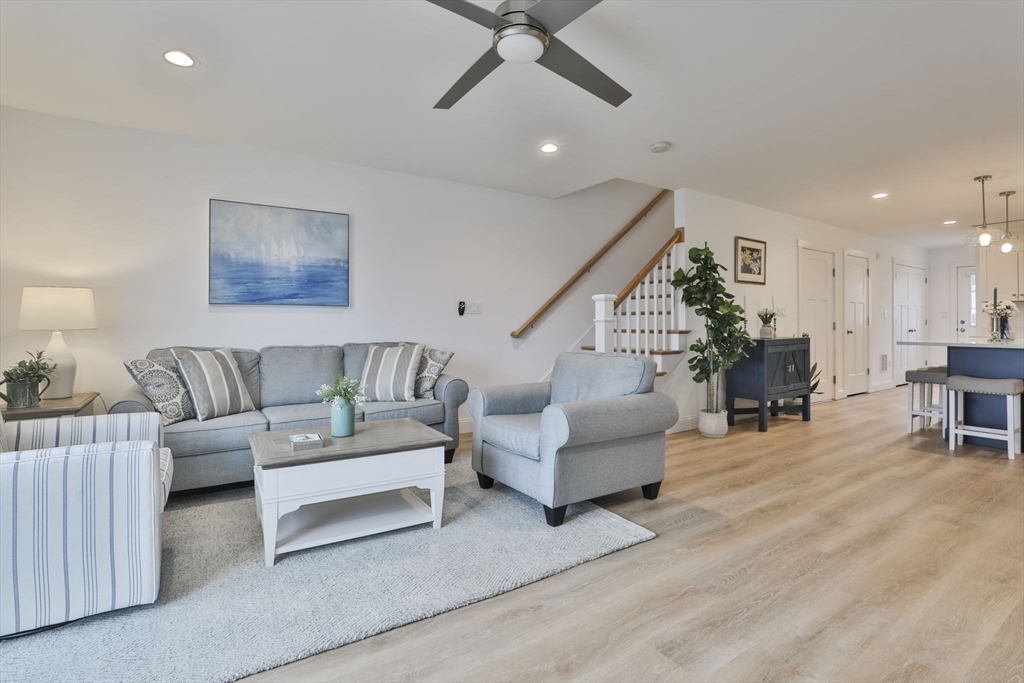 207 Beach Road, Unit C2 Salisbury, MA 01952 - Photo 16 of 35 a living room with furniture and a wooden floor