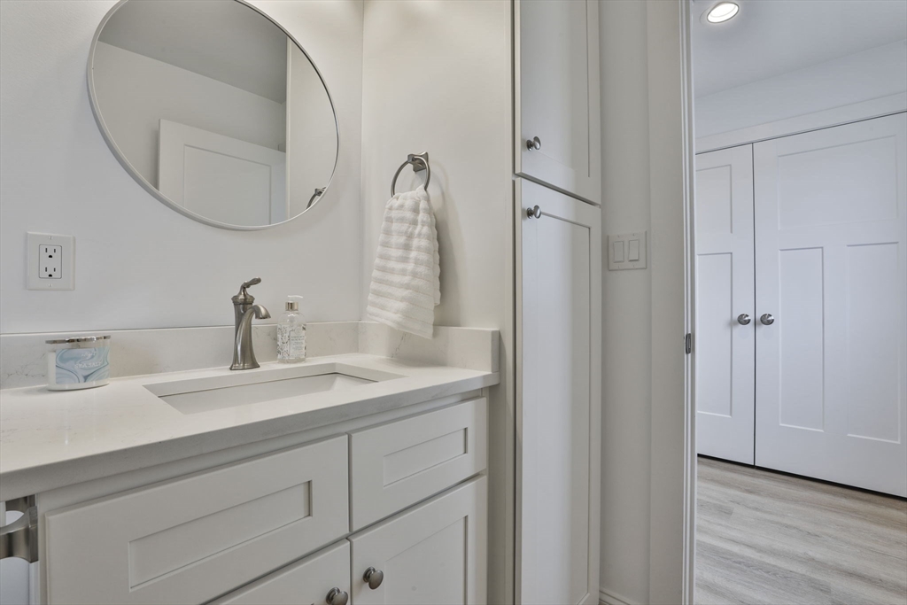 207 Beach Road, Unit C2 Salisbury, MA 01952 - Photo 19 of 35 a bathroom with a sink and a mirror