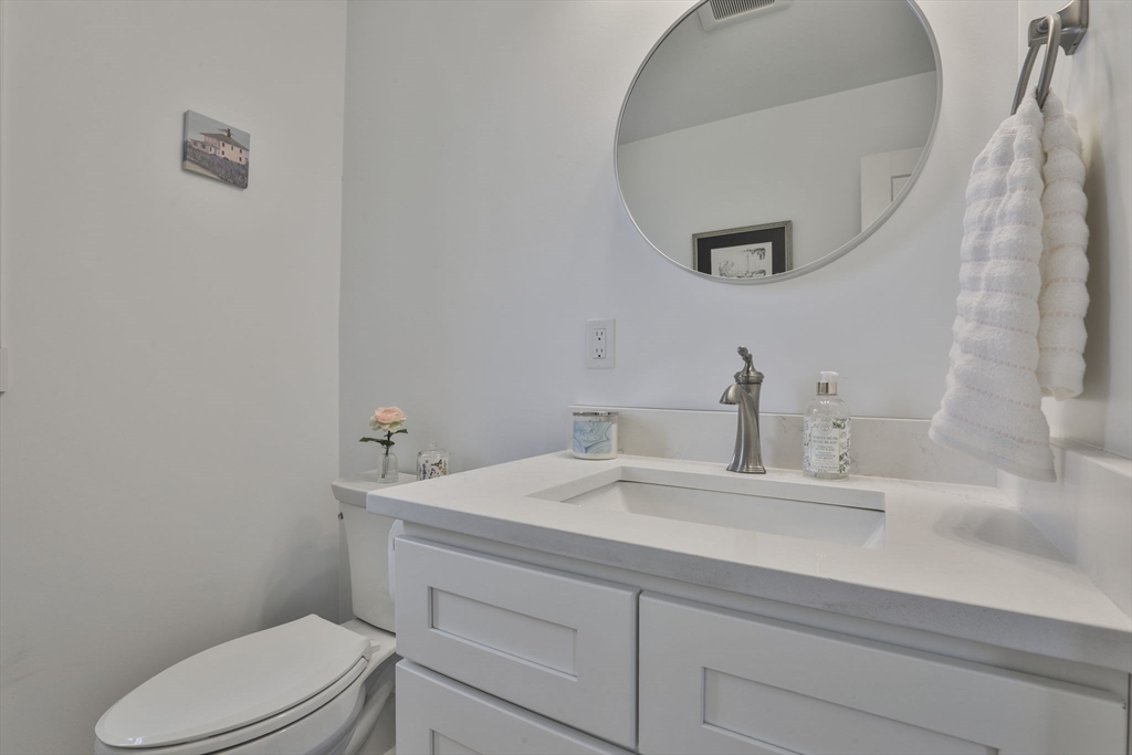 207 Beach Road, Unit C2 Salisbury, MA 01952 - Photo 20 of 35 a bathroom with a sink a toilet and a mirror
