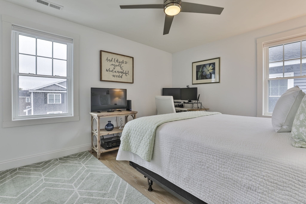 207 Beach Road, Unit C2 Salisbury, MA 01952 - Photo 25 of 35 a bedroom with a bed and a window