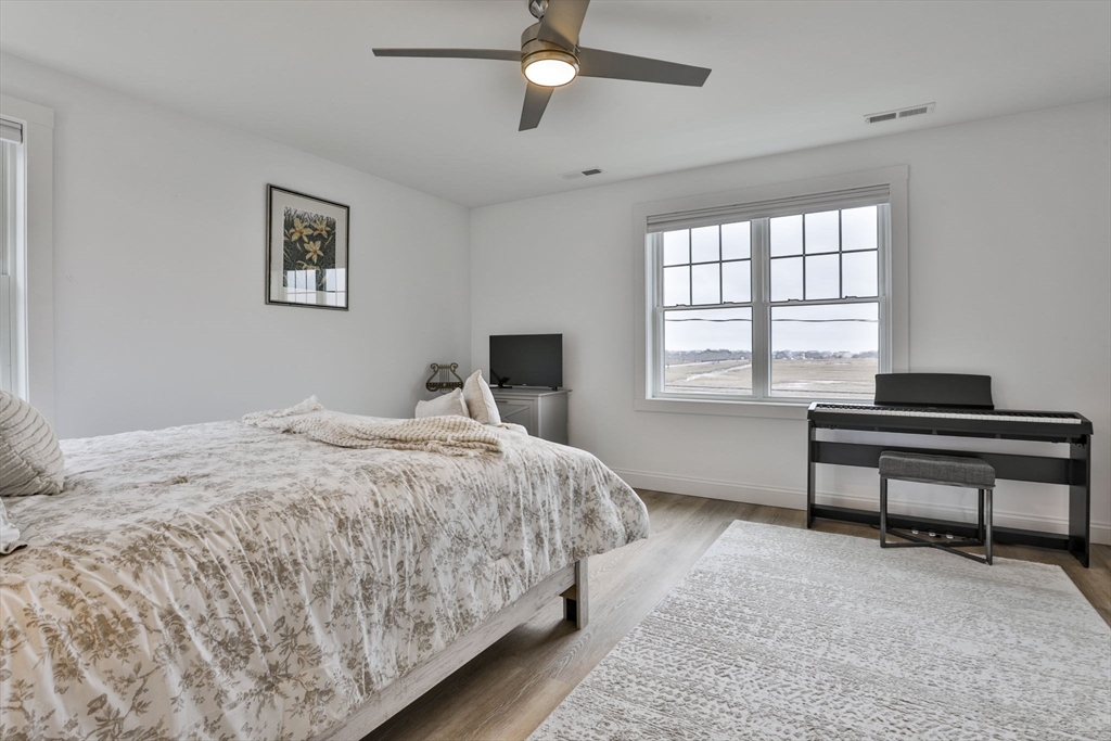207 Beach Road, Unit C2 Salisbury, MA 01952 - Photo 28 of 35 a bedroom with bed and window