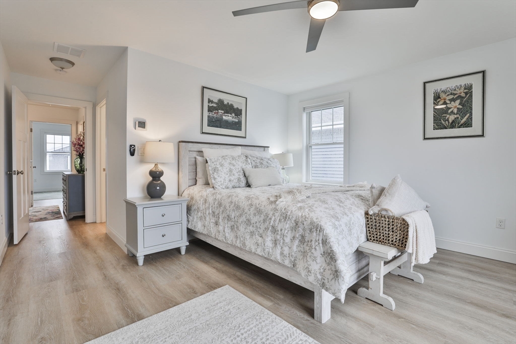 207 Beach Road, Unit C2 Salisbury, MA 01952 - Photo 29 of 35 a bed room with a bed and painting on the wall