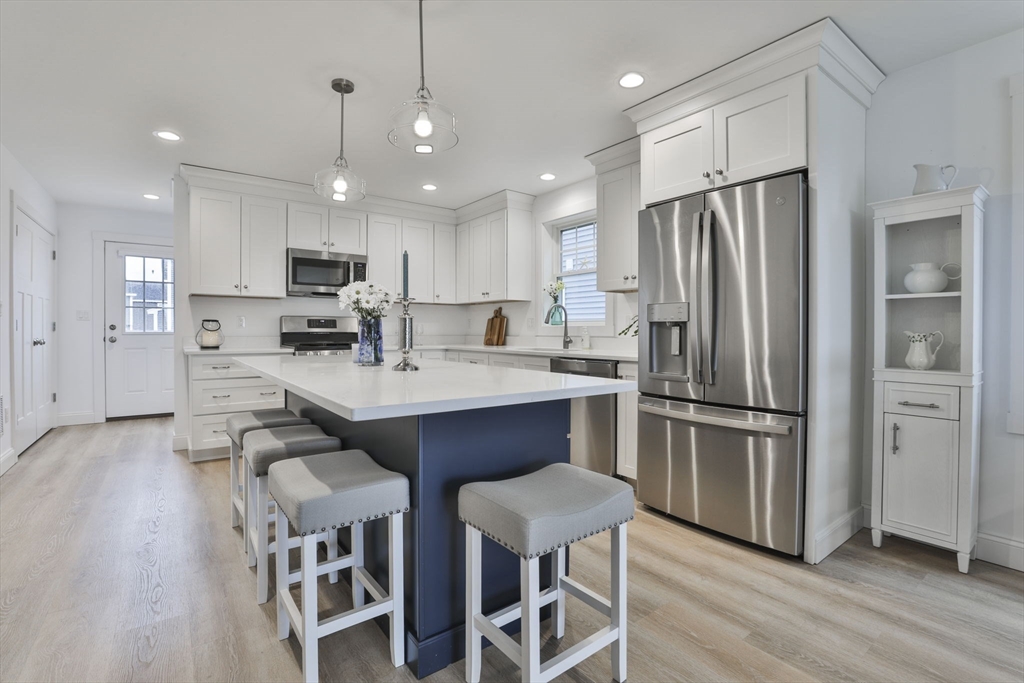 207 Beach Road, Unit C2 Salisbury, MA 01952 - Photo 5 of 35 a kitchen with stainless steel appliances a refrigerator sink and cabinets