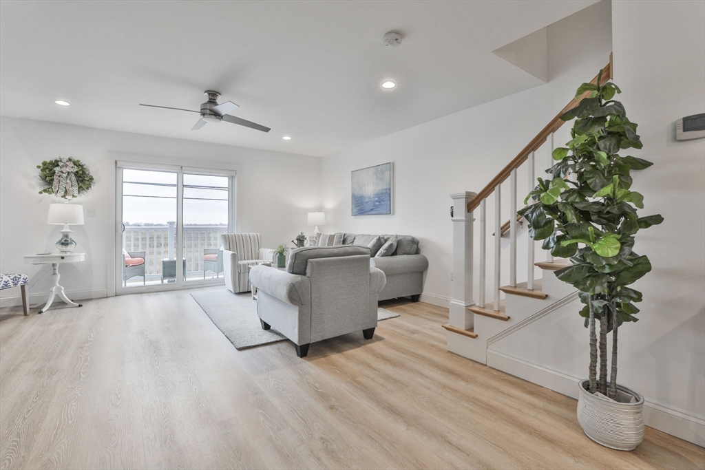 207 Beach Road, Unit C2 Salisbury, MA 01952 - Photo 10 of 35 a living room with furniture and a potted plant