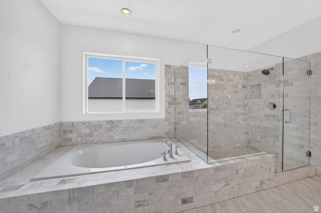 1002 West Temple Rim Lane Payson, UT 84651 - Photo 31 of 68 Walk-in shower with clear glass enclosure and built-in niche, featuring tile surround and dual-function shower head