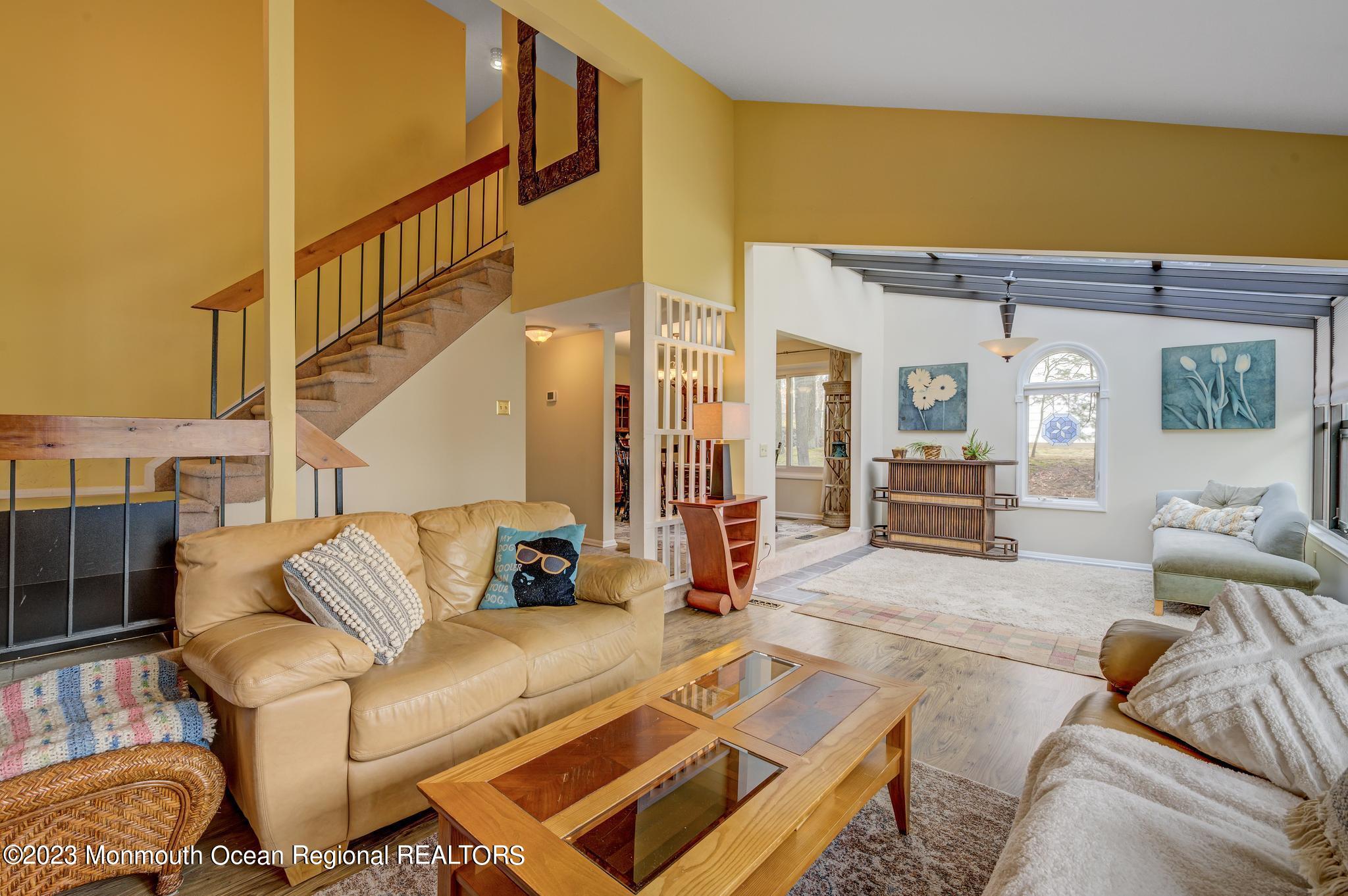 39 Chelsea Road Jackson, NJ 08527 - Photo 14 of 25 living and sunroom