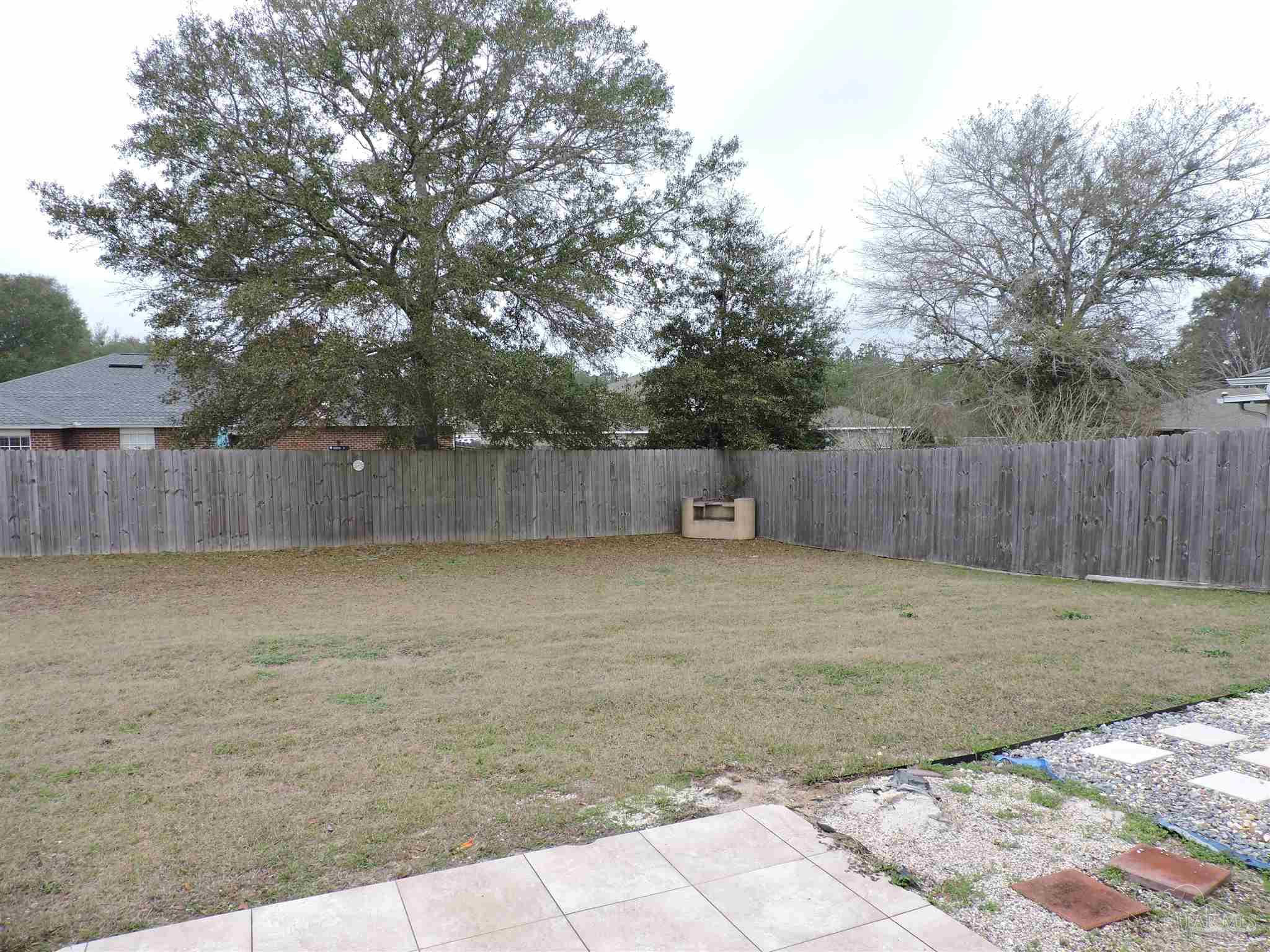 7070 Marissa Point Lane Milton, FL 32570 - Photo 20 of 21 a backyard of a house