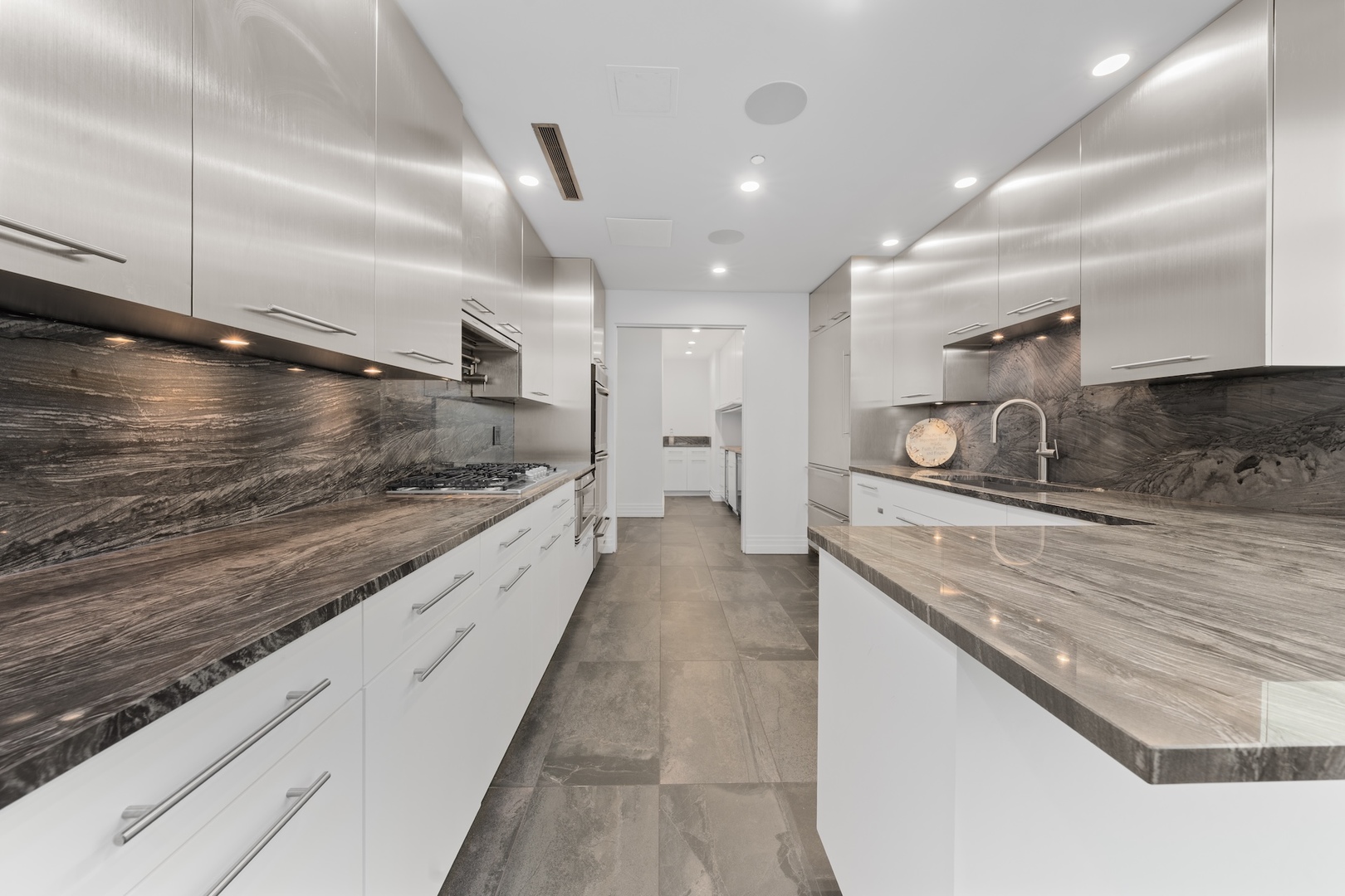 600 North Kingsbury Street, Unit 506 Chicago, IL 60654 - Photo 14 of 71 a large kitchen with kitchen island granite countertop a large counter top