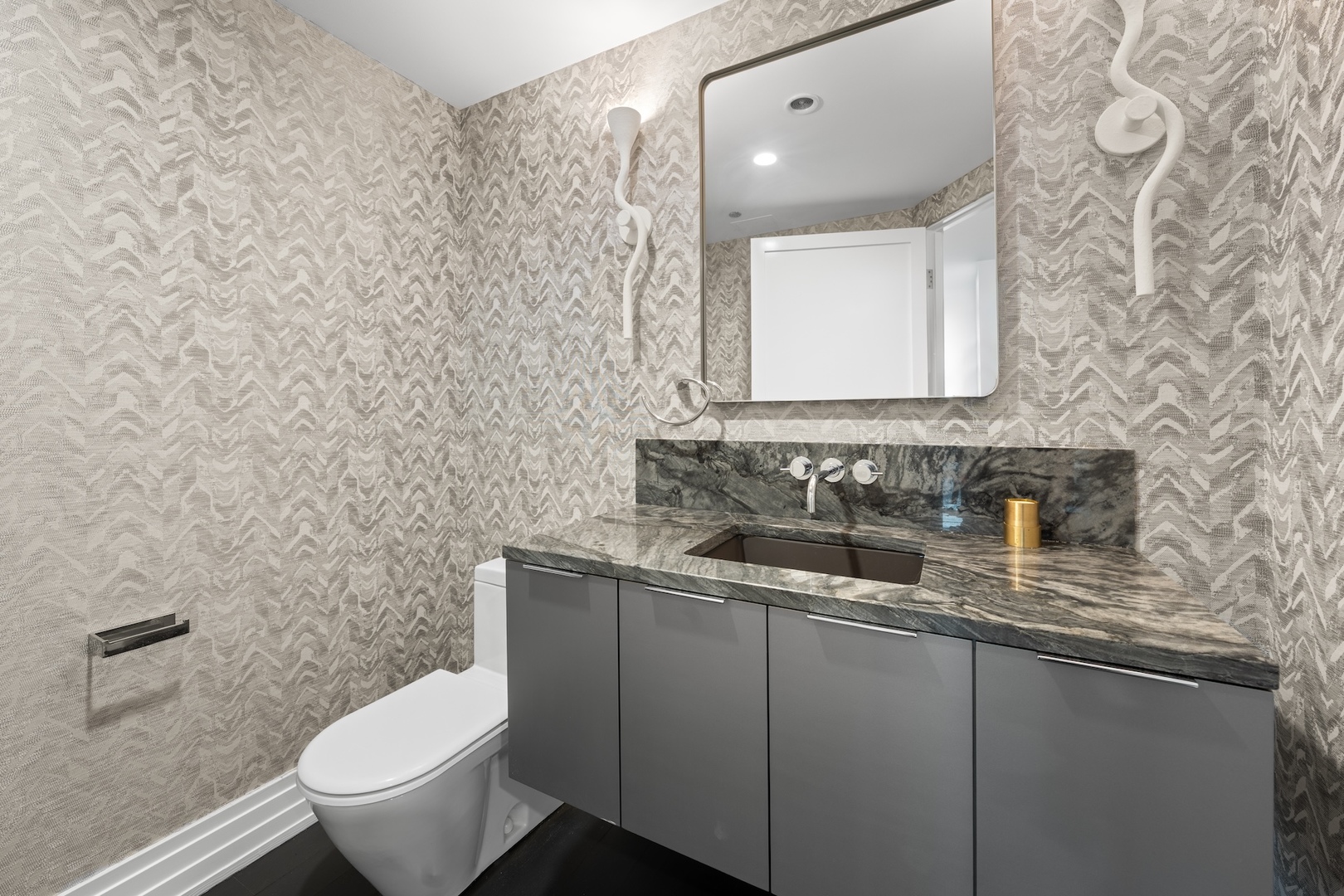 600 North Kingsbury Street, Unit 506 Chicago, IL 60654 - Photo 20 of 71 a bathroom with a toilet sink and mirror