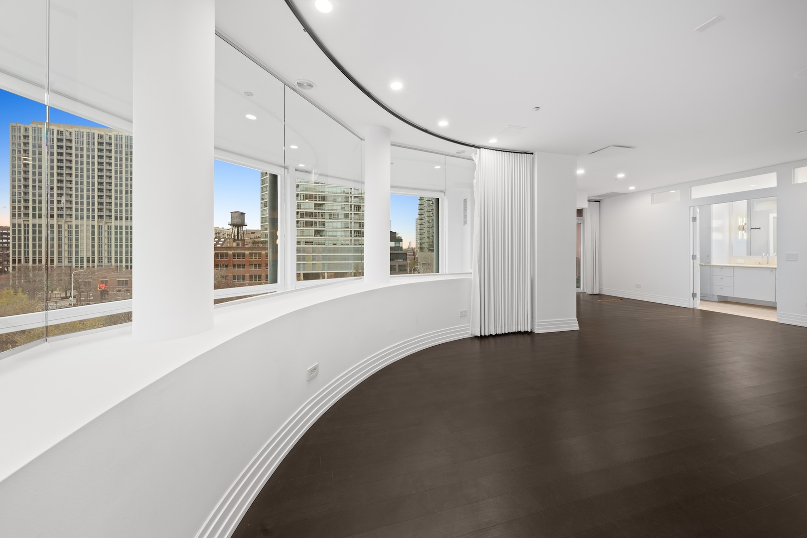 600 North Kingsbury Street, Unit 506 Chicago, IL 60654 - Photo 38 of 71 a view of an empty room with a window and wooden floor