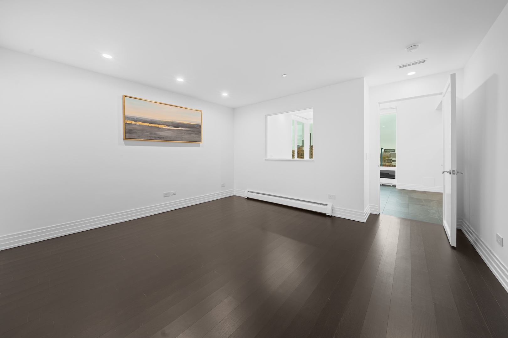 600 North Kingsbury Street, Unit 506 Chicago, IL 60654 - Photo 7 of 71 an empty room with wooden floor and windows