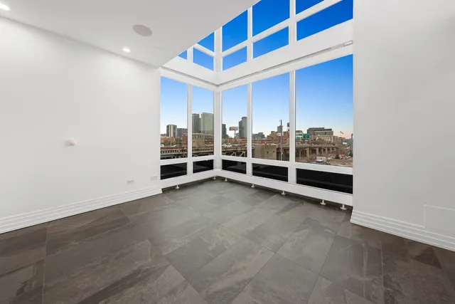 a view of a big room with windows