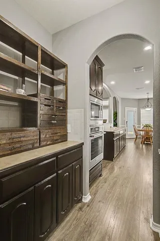 a view of a house with a yard and wooden fence