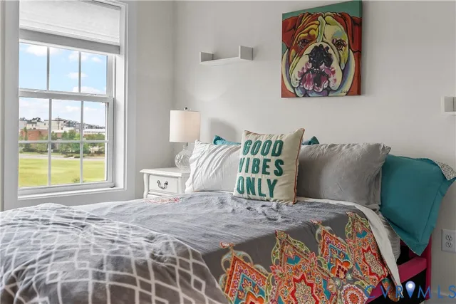 a bedroom with a bed and window