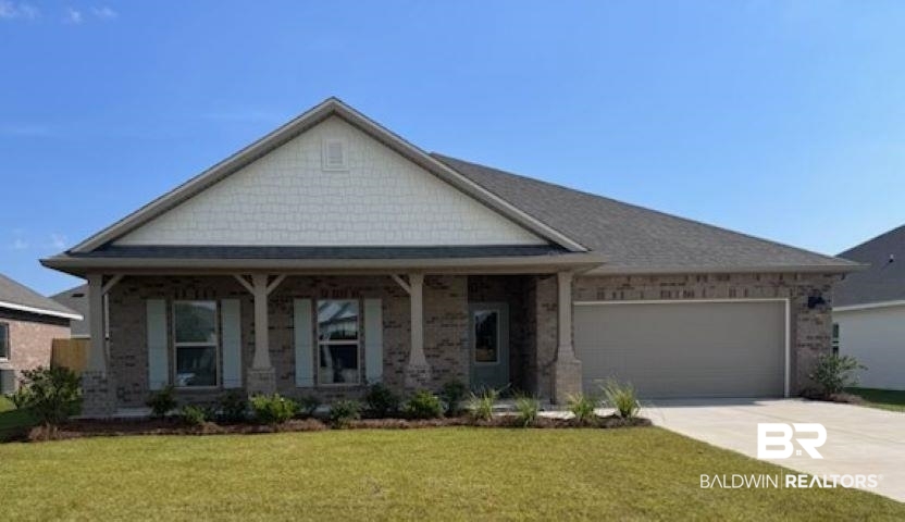 409 Raley Farms Drive Gulf Shores, AL 36542 - Photo 1 of 30 Craftsman-style house featuring a front lawn, covered porch, concrete driveway, a garage, and brick siding