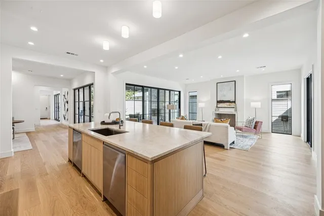 a open kitchen with stainless steel appliances granite countertop a lot of counter space