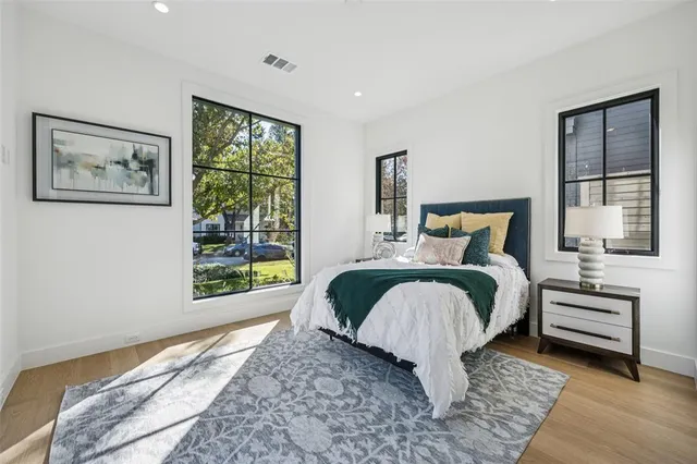 a bedroom with a large bed and a window