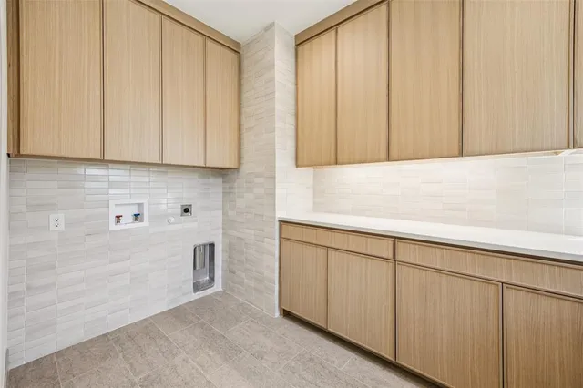 a view of kitchen with cabinets