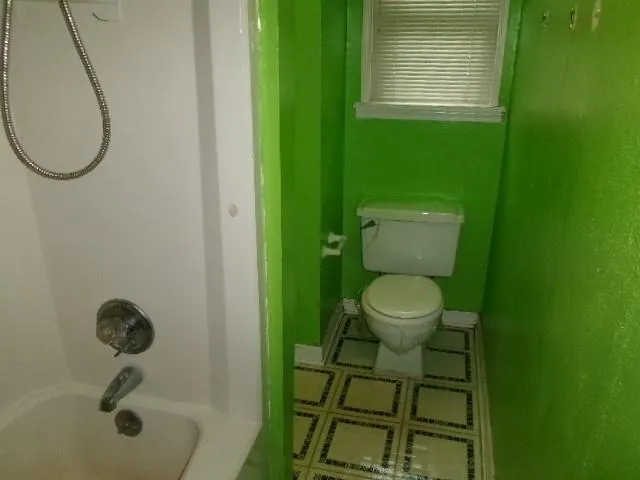 a bathroom with a toilet and a sink