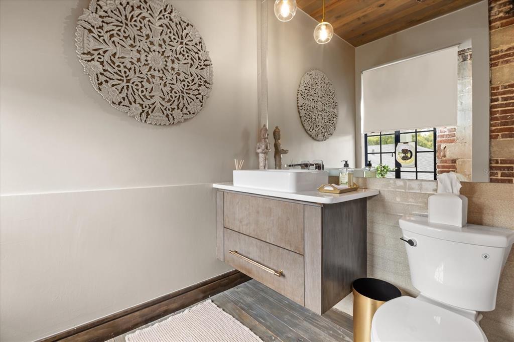 601 East Ridgewood Street Orlando, FL 32803 - Photo 18 of 86 a bathroom with a sink and a mirror