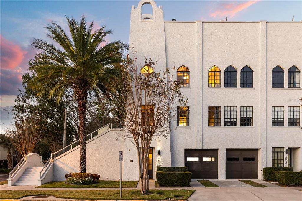 601 East Ridgewood Street Orlando, FL 32803 - Photo 2 of 86 a view of a white house with a large tree