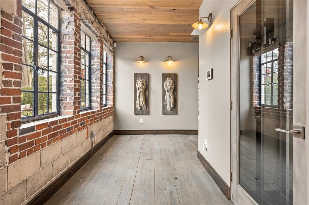 601 East Ridgewood Street Orlando, FL 32803 - Photo 22 of 86 a view of a hallway with wooden floor and staircase