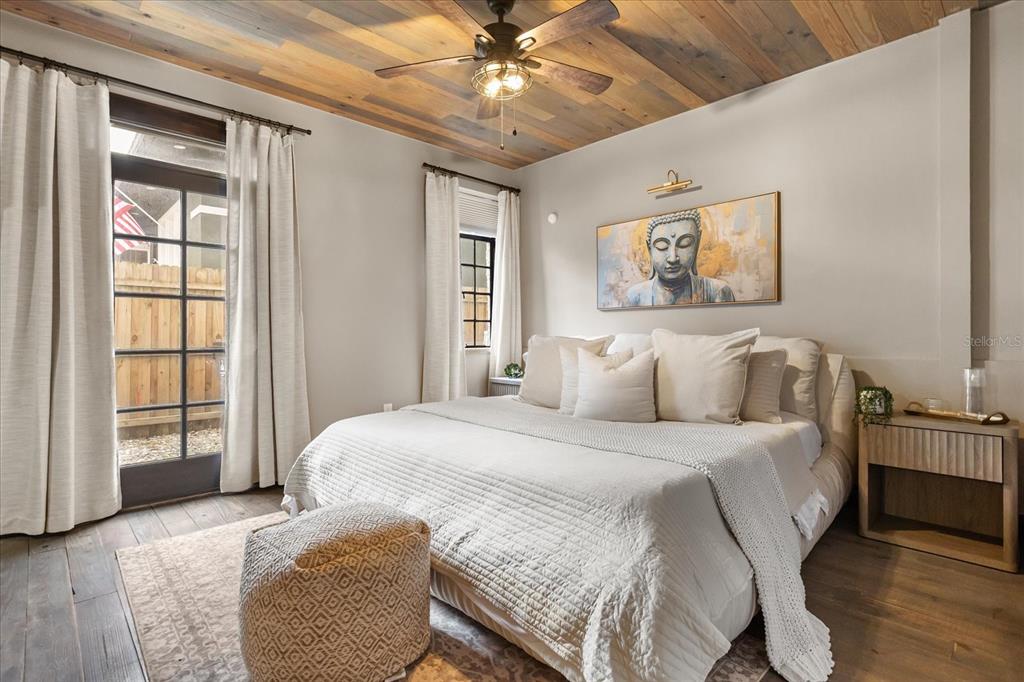 601 East Ridgewood Street Orlando, FL 32803 - Photo 23 of 86 a bedroom with a large bed and a window