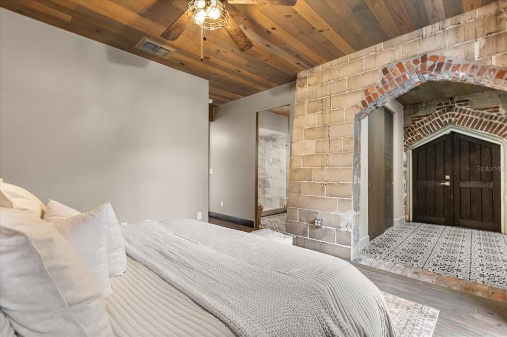 601 East Ridgewood Street Orlando, FL 32803 - Photo 24 of 86 a bedroom with a bed and a dresser