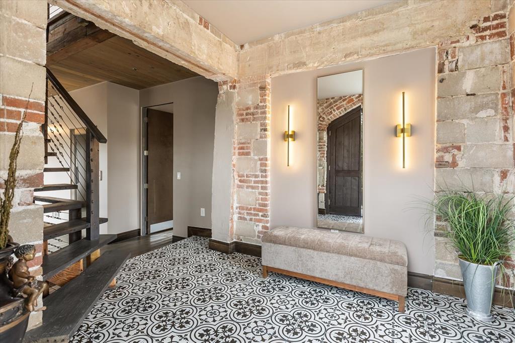 601 East Ridgewood Street Orlando, FL 32803 - Photo 28 of 86 a living room with furniture and a potted plant